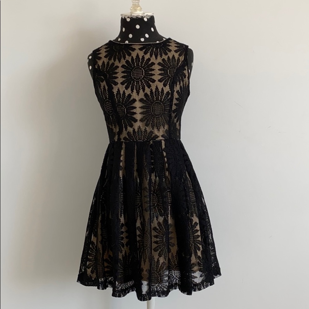 Black sleeveless dress with mesh overlay